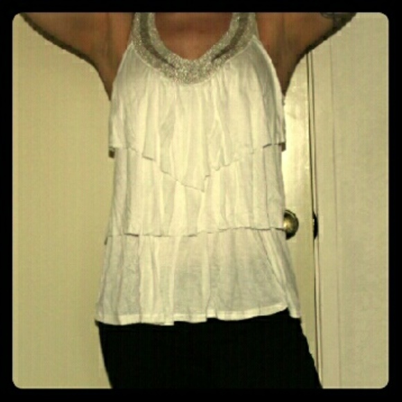 Ruffled ivory top with beaded neckline