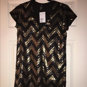 Black and gold sequin dress