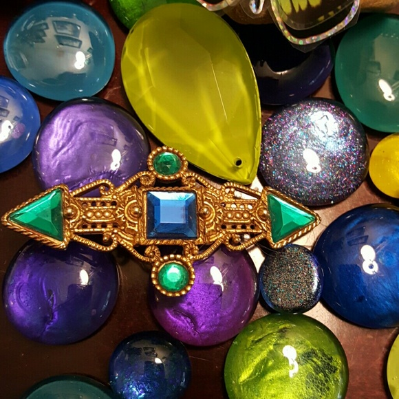 Gold tone pin with blue and green crystals