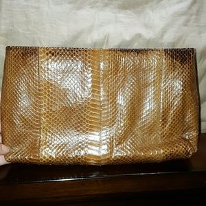 Snake skin clutch.