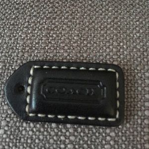 Small black leather Coach tag