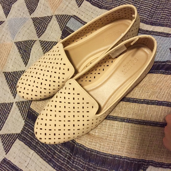 Perforated cream slip-ons