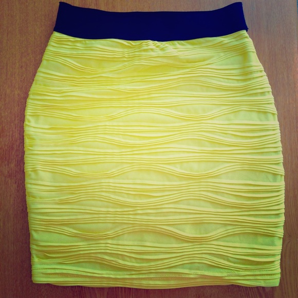 Bright yellow textured body con miniskirt.