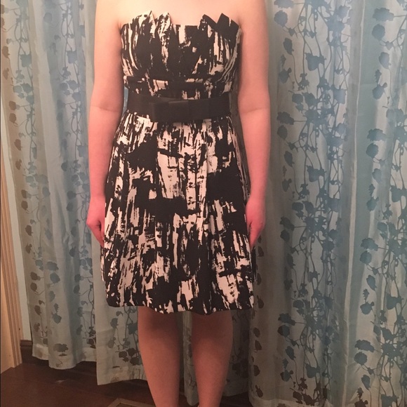 Black and white sleeveless belted homecoming dress