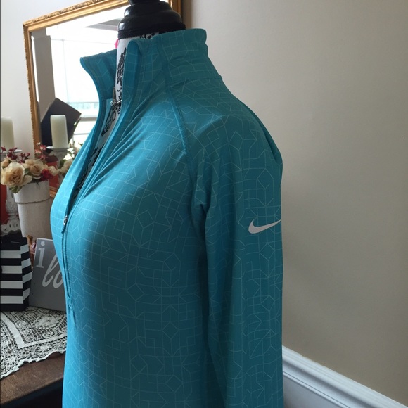 Nike Tops - sold Nike half zip pull over aqua blue color