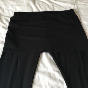 CAbi black leggings with attached miniskirt