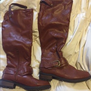 Trendy, knee high, flat boots.