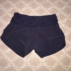 Lulu Lemon running shorts with back zipper.