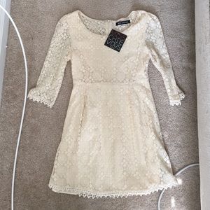 Cream/white lace dress.
