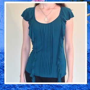 blue top with ruffles