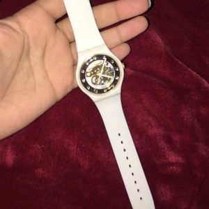 White and gold Swatch skeleton watch