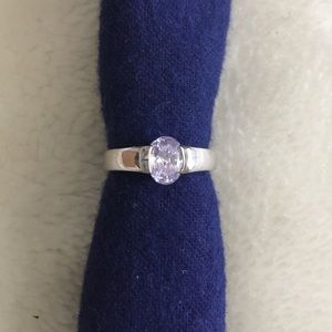 Silvertone ring with oval purple stone size 9