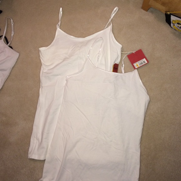 two white tanks tops