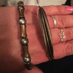 2 bangle bracelets gold and silver tone feather