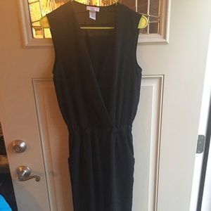 black jumpsuit with plunge neckline.