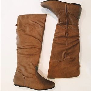 Flat brown knee high boots