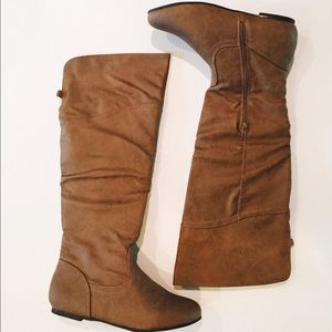 Flat brown knee high boots