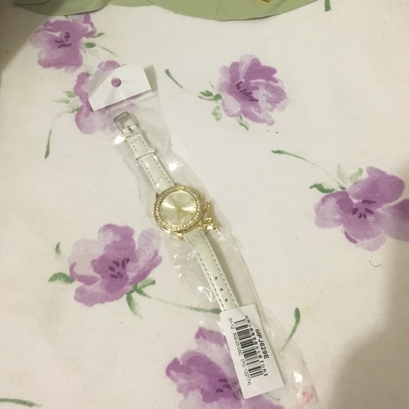 White watch with a Eiffel tower charm