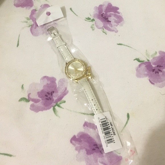 White watch with a Eiffel Tower charm