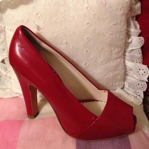 red high Italian leather.Open toe.Covered platform