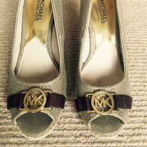 Michael Kors emblem wedges.