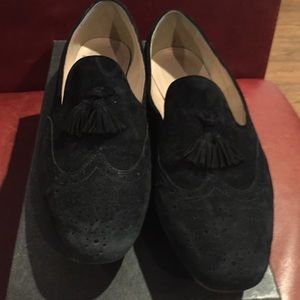 Black suede loafers with tassels