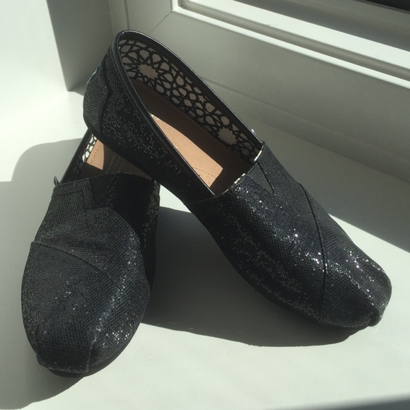 Tom's sparkly black slip-ons!