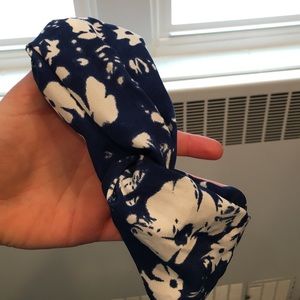 blue floral headband and black/tan headband