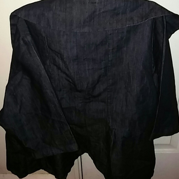 Its a jacket it has big gold buttons. Blue.