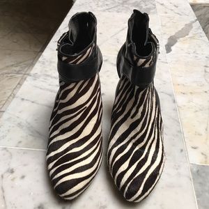 Black and white high heel ankle bootie.