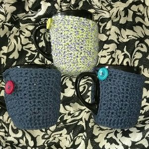 3 beautiful black mugs with mug sweaters