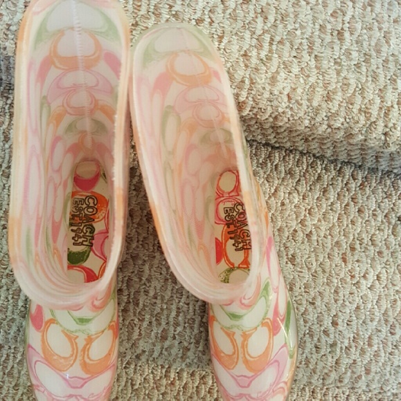 Multicolored Authentic Coach rainboots.