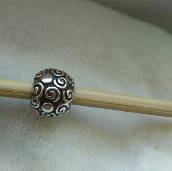 Retired small swirls Pandora charm