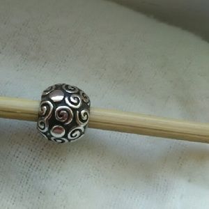 Retired small swirls Pandora charm