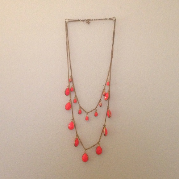 Necklace with gold chain and pink tear drop beads