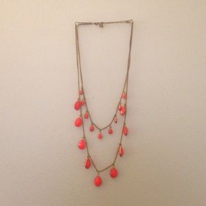 Necklace with gold chain and pink tear drop beads