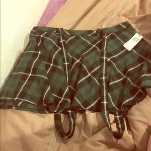 Green and white plaid suspender school girl skirt