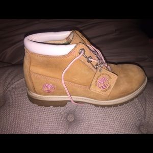 Gently used timberlands with pink stitching