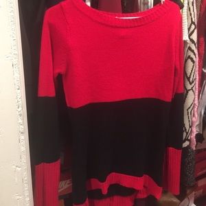 Black and red sweater runs small