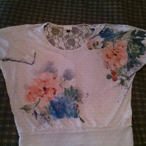 Beautiful flowery blouse with lace.