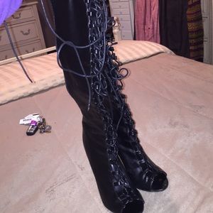Knee high lace up black leather boots