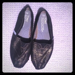 TOMS gold sparkle slip ons