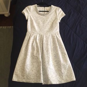 White dress with a beaded neckline