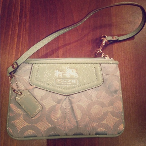 Light blue/teal Coach wristlet