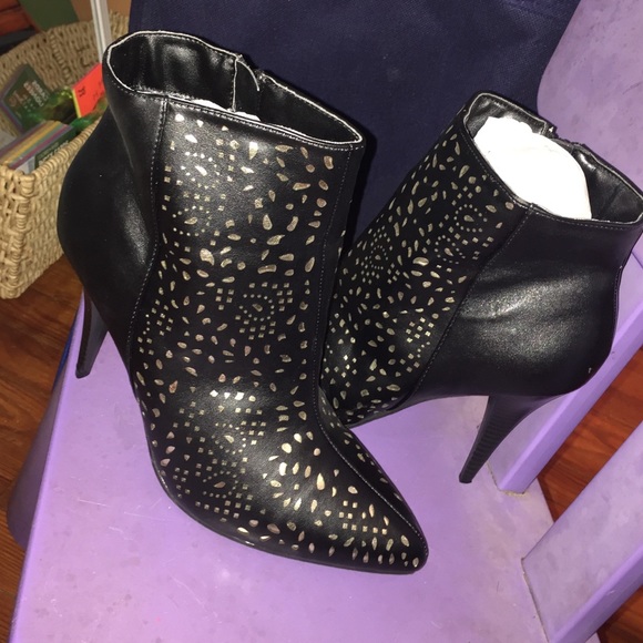 Black booties with gold design