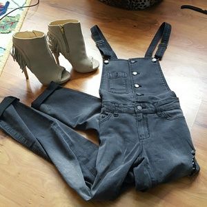 Distressed skinny overalls