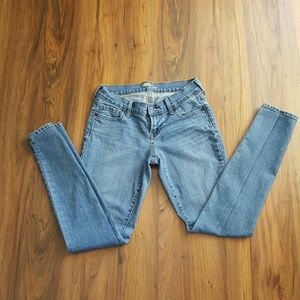 Medium wash Petite skinny jeans