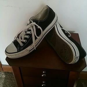 Worn black and white converse