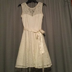 Ivory lace dress with a low cut back