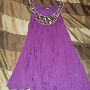 Long sleeveless top with jeweled neckline